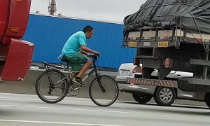 Bicycle Catches a Ride Behind Truck