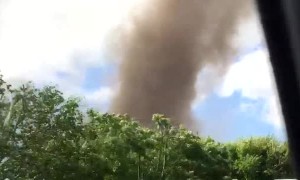 Car Approaches Massive Tornado
