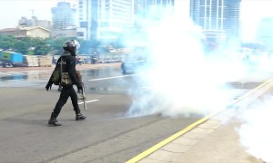 Police deploy tear gas, water cannon against hard-line Buddhist monks in Sri Lanka