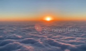 Gorgeous time-lapse shows sunrise over clouds roiling like waves