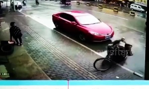 Three-wheeler driver gets knocked into his own trailer in funny car accident