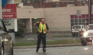 Cop Directs Traffic to the Beat