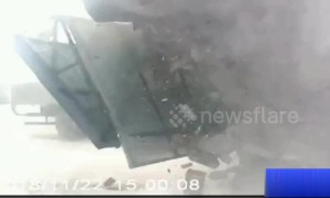 Passerby runs away seconds before warehouse collapses in dramatic crash