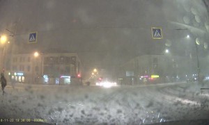 Pedestrian Rolls over Snowy Road