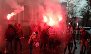 Flares and fire as Ukrainians protest outside Russian consulate in Kharkiv