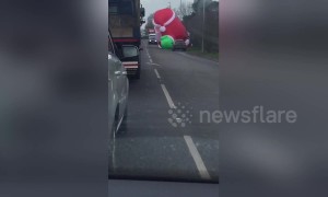 Giant inflatable Santa drifts onto road causing traffic chaos