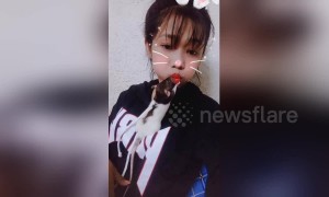 Girl goes for selfie but keeps getting interrupted by over-affectionate rat