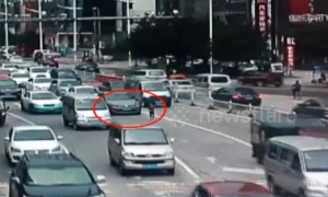 Girl falls out of three-wheeler onto busy road