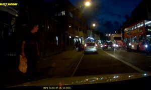 Pedestrian and Motorcyclist Collide on Busy Street