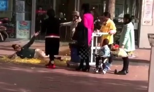 Women toss up piles of fallen leaves for a 'natural photo shoot'
