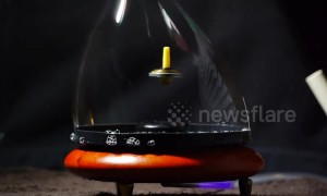 Spinning top levitates inside smoke-filled bubble