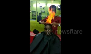Drop the scissors! Indian barber trims customer's hair by setting it on FIRE