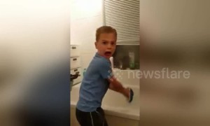 Son's reaction is priceless when dad scares him from behind