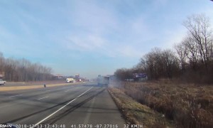 Car Sandwiched Between Semi and Concrete Barrier