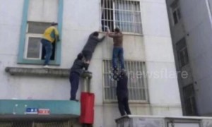 Kind-hearted neighbours save toddler hanging from second-floor window