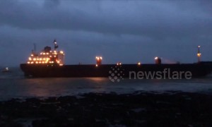 Russian cargo ship stranded on UK beach during low tide