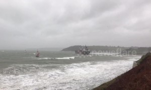 Lifeboat and two tugboats approach grounded Russian tanker off Cornish coast