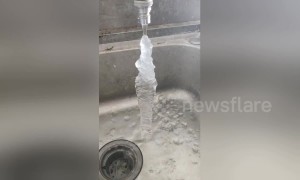 Water running out of tap freezes solid in midair in northern China