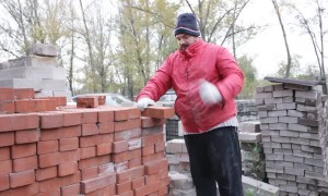 Man Breaks Bricks By Hand