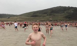 Taking the plunge: Hundreds run into sea near UK's Land's End on Christmas Day