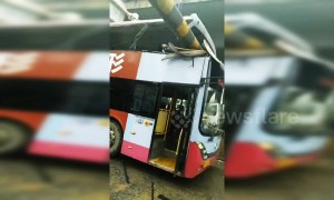 Passenger killed when double-decker bus crashes into height barriers