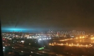 View from flight shows eerie blue grow lighting up New York City sky after transformer explosion