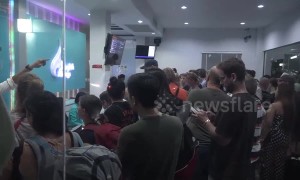 Hundreds of stranded tourists bombard airport as storm approaches Thailand