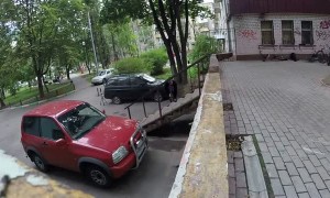 BMW rider crashes into parked car while attempting jump