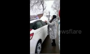 Chinese villagers sell ready-made snowmen after rare blizzards