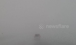 Driver navigates through harrowing zero-visibility road during Finland winter