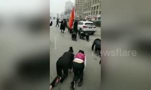 Chinese employees crawl along road as punishment for not reaching target