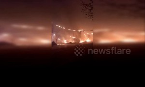 Power lines cause huge fire in Chinese city damaging vehicles