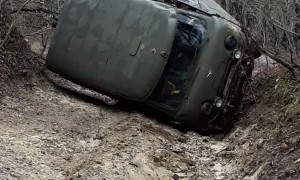 Utility Vehicle Gets Back Up After Being Stuck in a Rut