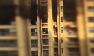 Two residents forced to jump to lower floor to escape high-rise fire