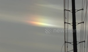 Cold weather in Toronto causes rainbow-like refraction in the sky