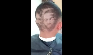 Barber shaves boxers Manny Pacquiao and Adrien Broner into customer's hair