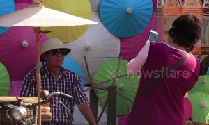 Tourists enjoy colourful umbrella festival in northern Thailand