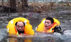 Old man who waded into icy river to rescue his dog gets trapped and has to be rescued