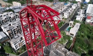 Thai builder left hanging 200ft in the air after crane collapses