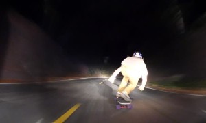 Skilled Nighttime Downhill Skateboarding