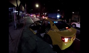 Touching moment cyclist helps an elderly stranger get out of New York taxi