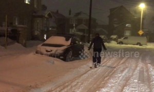 Canadian man goes skiing through Toronto streets during snowstorm
