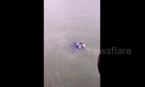 Good Samaritan rescues driver stuck in car sinking into a river