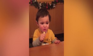 Baby Makes Cute Faces when Eating a Lemon