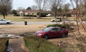 Young Boy and Officer Have Wholesome Game of Catch