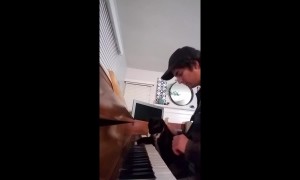 Cat learns piano in cutest duet ever