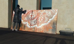 Polish street artist causes a splash with colourful lace-pattern murals