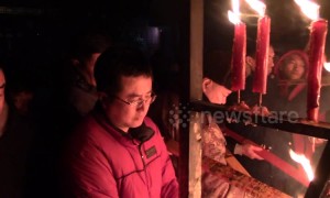 Thousands of citizens queue to burn incense in temple for new year wishes