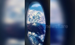 Creative man uses washing liquid bottle and phone to fake travelling on plane