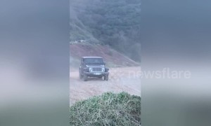 Hardtop Jeep turns into instant convertible after jump fail